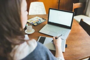 Young woman artist working at home